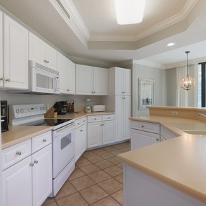 Create delicious meals with ease in the bright kitchen, perfect for culinary adventures