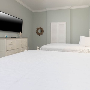 Unwind in this queen guest suite and stream your favorite shows or enjoy a good movie after a beach day