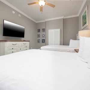 Sink into one of the queens and enjoy a good movie in this welcoming guest room