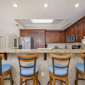 Gather at the stylish bar seating, perfect for enjoying meals and conversations