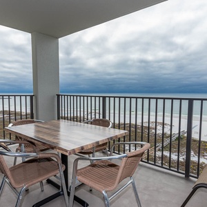 Balcony seating offers a serene view of the beach and gulf, perfect for relaxing and enjoying the coastal atmosphere