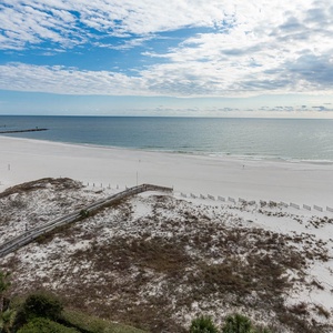 Enjoy stunning views of the shoreline and tranquil waters from your spacious outdoor area, perfect for relaxation