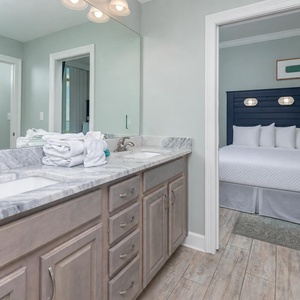 Freshen up in this guest bath in the relaxing shower or soothing tub before an exciting beach day