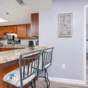Gather at the breakfast bar enjoying a view of the inviting kitchen with coffee and conversation