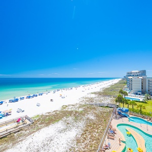From your balcony, watch families play beneath vibrant umbrellas while the lazy river gently coils below
