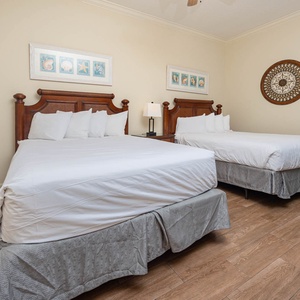 Rest peacefully in this queen guest suite, surrounded by cheerful decor, ready to recharge for a fun day at the beach