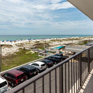 Relax with beachfront views from this inviting balcony, perfect for relaxation and soaking up the sun