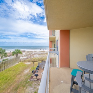 Relax on the balcony with a beautiful view of the pristine beach and sparkling blue waters