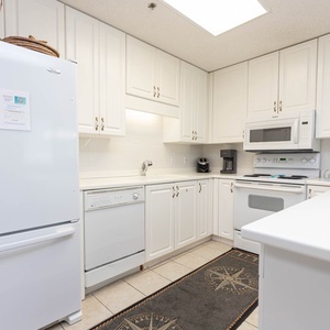 The spacious countertop create a welcoming atmosphere in this inviting and open kitchen space