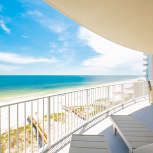 Bask in the sun on the spacious balcony enjoying sweeping views of the sparkling waters below