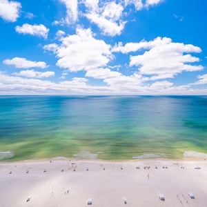 Watch the coastline stretch into the distance and the horizon meet the sky from your balcony while you soak up the sun