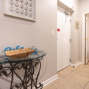 Step into a welcoming entryway featuring a stylish console table and easy access to the cozy bedroom beyond