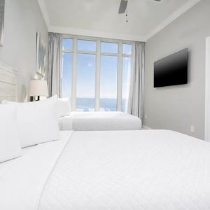 Unwind in this queen guest suite and stream your favorite shows or enjoy a good movie after a beach day