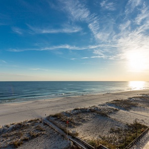 This stunning beachfront view showcases serene waters and soft sands, perfect for a relaxing getaway