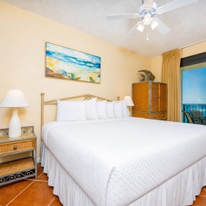 Unwind in the spacious master suite with a plush king bed and beachfront balcony access