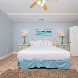 Sink into plush king bedding in this guest suite with a calming atmosphere and coastal decor