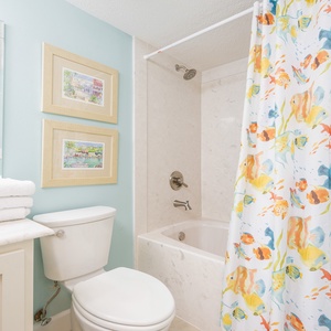 Refresh yourself in this guest bathroom, where coastal decor adds a cheerful vibe to your daily routine