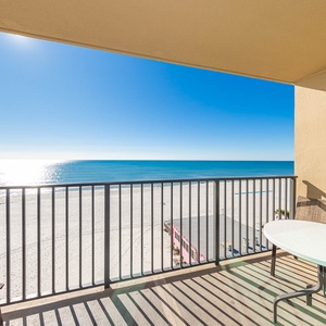 Enjoy the fresh air on the balcony with seating and sweeping views of the tranquil waters and shoreline
