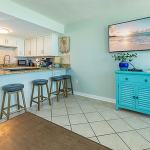 Beautiful granite countertops with a breakfast bar and seating for four