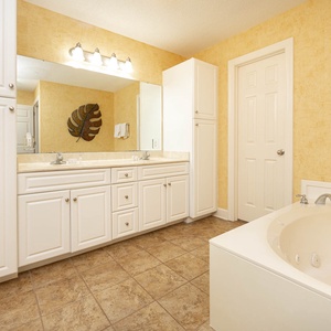 Indulge in rejuvenating moments in the master bath, complete with a relaxing jetted tub and dual vanity