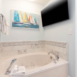 Soak in the jetted tub, admire the sailboat art, and relax with your favorite show for a soothing stay