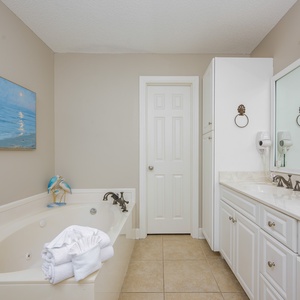 Indulge in a relaxing soak in the jetted tub in the master bath, surrounded by inviting decor