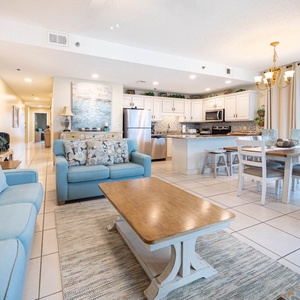Unwind in the spacious living area with plush seating, a dining table, and a kitchen that invites culinary creativity