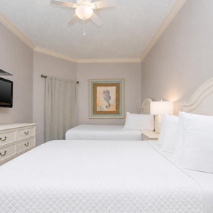 Unwind in this queen guest suite and stream your favorite shows or enjoy a good movie after a beach day