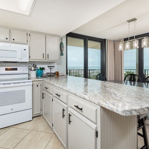 Brew your favorite coffee and enjoy the inviting vibe from your kitchen while gazing at the stunning coastal view