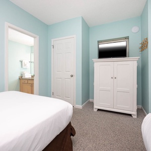 Unwind in this inviting guest room with two double beds, a TV, and easy access to a bathroom for your convenience