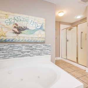 Refresh in the master bath after a day at the beach with a soothing jetted tub and relaxing walk-in shower