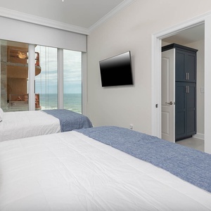 Watch the gulf through the room's windows or stream your favorite shows in this queen guest suite