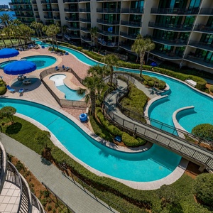 Relax by the stunning bay view pool area featuring a lazy river, waterslide, and a coastal vibe for ultimate comfort