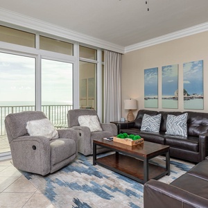 Relax on the sofa with a queen sleeper while soaking in the beach views from the balcony