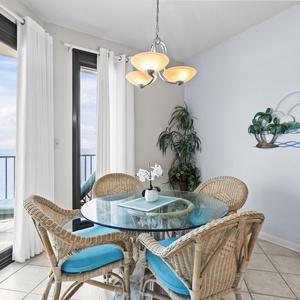 Gather around the glass dining table, feeling the vibrant vibe as you enjoy conversations enhanced by coastal views