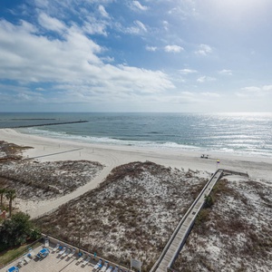 Serene shoreline and gentle waves, inviting you to relax and enjoy the coastal atmosphere