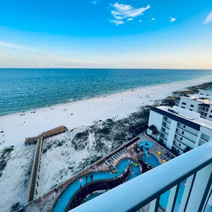 Watch the beach activities and the winding lazy river and pool area below