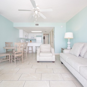 Unwind in the airy living space with comfortable seating and a dining area, perfect for enjoying meals together