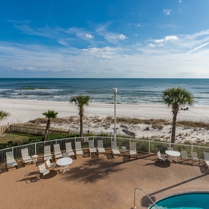 Compliment your stay with a stunning beachfront view with a sparkling pool and lounge chairs for relaxing in the sun