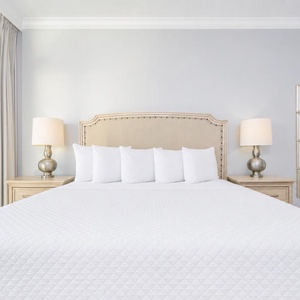 Unwind in the serene master bedroom featuring a king bed, stylish decor, and beach balcony