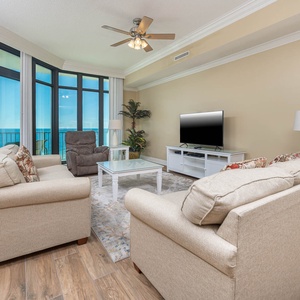 Feel the coastal vibe in this living space with a queen sofa sleeper while enjoying a movie and the stunning views