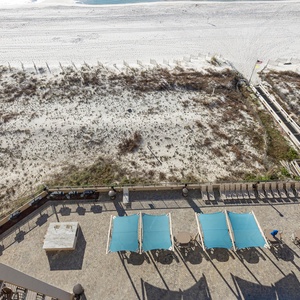 Relax on the spacious patio pool area with shaded seating, perfect for enjoying the view and fresh air