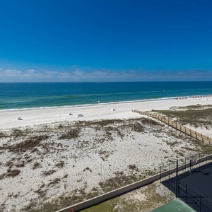 Tranquil waters and expansive shoreline from your balcony, perfect for enjoying the coastal breeze