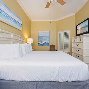 Relax on the cozy king bed in this guest suite and enjoy a movie after a beach day