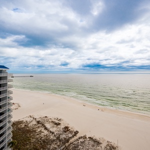 The condo features a stunning beachfront view, perfect for relaxing with friends and enjoying the serene atmosphere