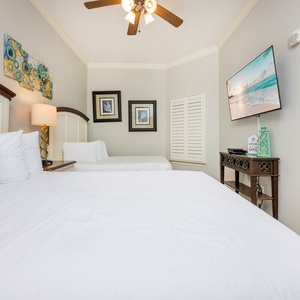 Relax in a cozy queen or full-size bed in this guest suite and stream your favorite shows after a beach day
