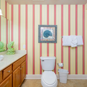 Refresh yourself in this cheerful guest bath, accented with playful decor and plush towels