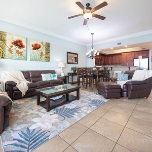 Unwind in the spacious living area with comfortable seating, decorative accents, and a welcoming vibe