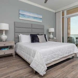 Retreat to the king master suite with cozy bedding and drift off to the sound of the waves from the balcony