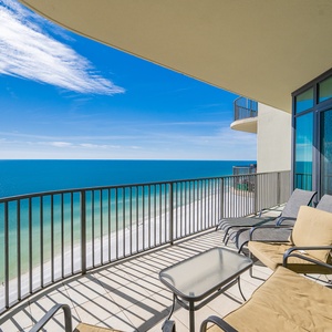 Relax in your comfy chairs on your balcony, taking in the stunning views and gentle sounds of the coast